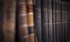 bound books on a shelf